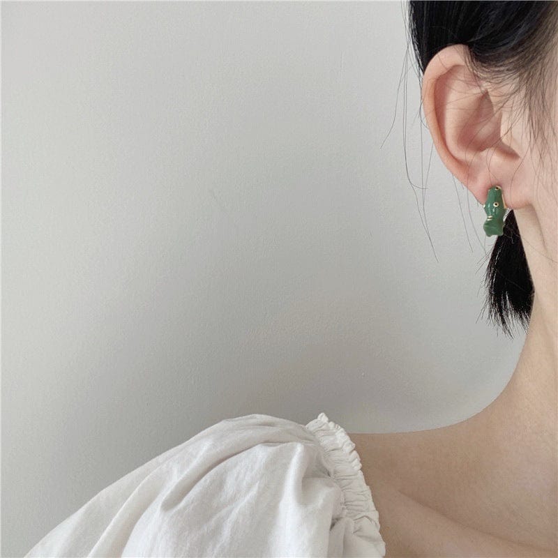 White Tanuki Green Dino Earrings